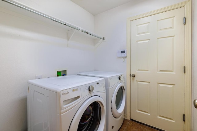 4308 Clear Meadow Pl, Round Rock, TX 78665 - laundry room with independent washer and dryer and dark tile patterned floors