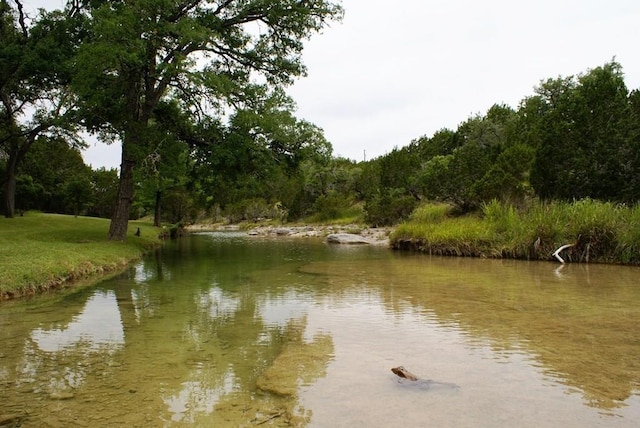 141 Hill Cv, Dripping Springs, TX 78620 - water view featuring a heavily wooded area