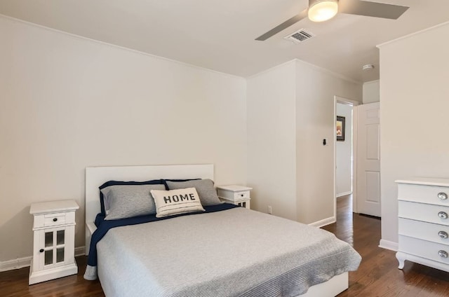 1202 Loma Dr, Austin, TX 78741 - bedroom featuring dark wood-style floors, crown molding, baseboards, and ceiling fan