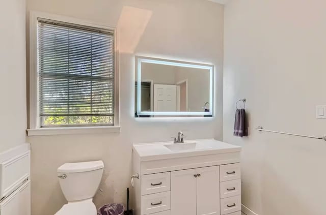 1202 Loma Dr, Austin, TX 78741 - half bath with vanity and toilet