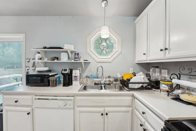 156 Kaeleku Ln, Bastrop, TX 78602 - kitchen with black appliances, a sink, white cabinetry, and light countertops