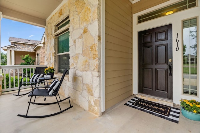 1610 Discovery Blvd, Cedar Park, TX 78613 - doorway to property with stone siding and a porch