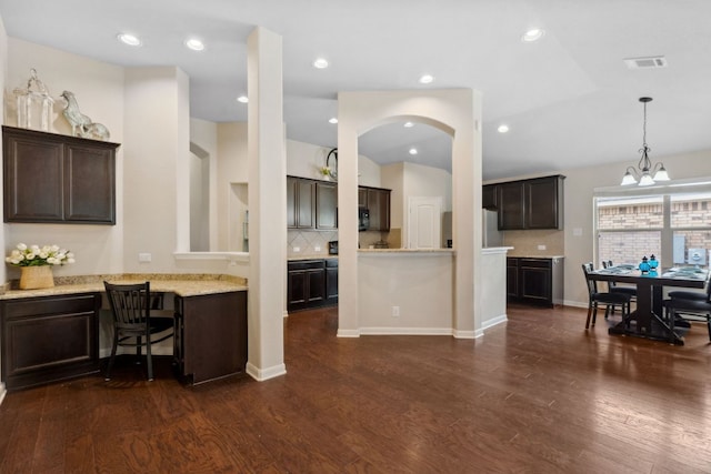 1610 Discovery Blvd, Cedar Park, TX 78613 - kitchen with fridge, dark brown cabinets, tasteful backsplash, and recessed lighting