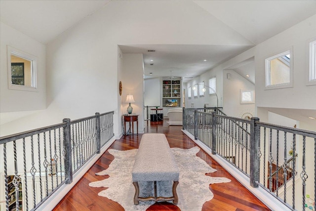 6012 Messenger Stake, Austin, TX 78746 - hallway featuring an upstairs landing, wood finished floors, and high vaulted ceiling