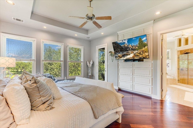 6012 Messenger Stake, Austin, TX 78746 - bedroom with multiple windows, a tray ceiling, recessed lighting, wood finished floors, and connected bathroom
