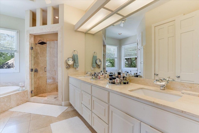 6012 Messenger Stake, Austin, TX 78746 - bathroom featuring a bath, a stall shower, double vanity, tile patterned flooring, and a ceiling fan