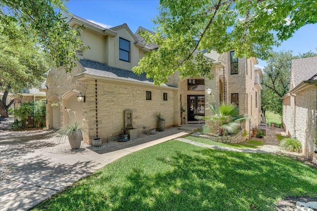 6012 Messenger Stake, Austin, TX 78746 - rear view of house with french doors, stone siding, stucco siding, a yard, and a shingled roof