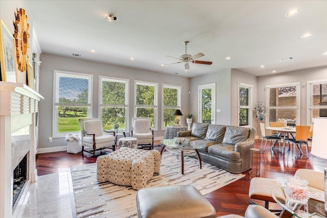 6012 Messenger Stake, Austin, TX 78746 - living area featuring a high end fireplace, recessed lighting, a ceiling fan, baseboards, and wood finished floors
