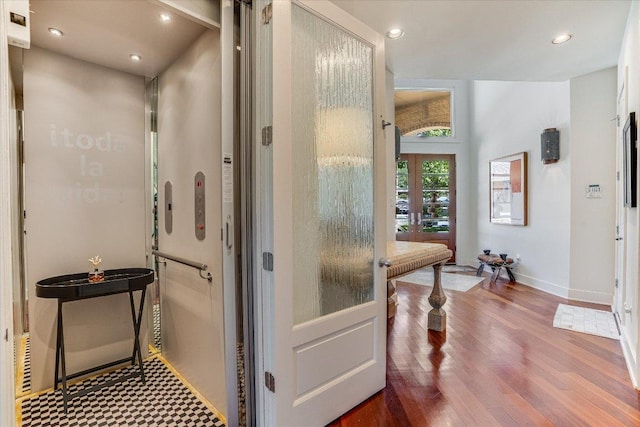 6012 Messenger Stake, Austin, TX 78746 - bathroom featuring baseboards, elevator, wood finished floors, and recessed lighting