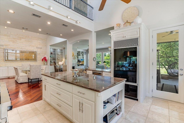 6012 Messenger Stake, Austin, TX 78746 - kitchen featuring ceiling fan, dark stone countertops, white cabinetry, light tile patterned flooring, and recessed lighting