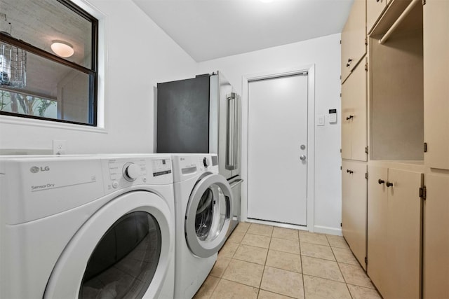 4839 Canyonbend Cir, Austin, TX 78735 - laundry area featuring separate washer and dryer, light tile patterned flooring, and cabinet space