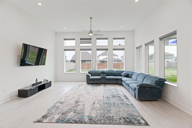 216 Reata Ridge Loop, Liberty Hill, TX 78642 - living room with healthy amount of natural light, ceiling fan, wood finished floors, and recessed lighting