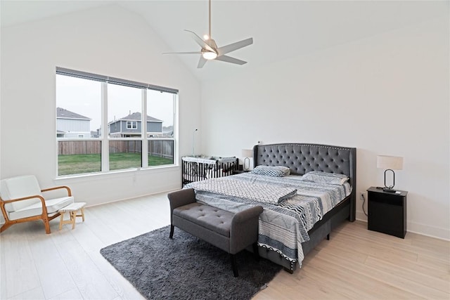 216 Reata Ridge Loop, Liberty Hill, TX 78642 - bedroom featuring light wood-type flooring, lofted ceiling, baseboards, and a ceiling fan