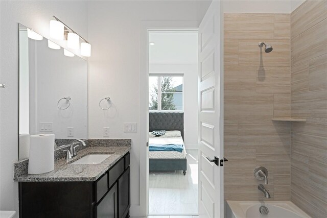 216 Reata Ridge Loop, Liberty Hill, TX 78642 - bathroom featuring vanity, ensuite bathroom, shower / bathtub combination, and tile patterned flooring