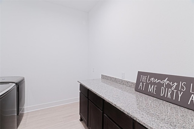 216 Reata Ridge Loop, Liberty Hill, TX 78642 - washroom featuring independent washer and dryer, cabinet space, and baseboards