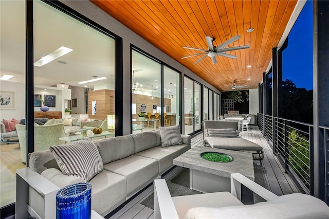 1337 Spyglass Dr, Austin, TX 78746 - sunroom featuring wooden ceiling, wood finished floors, and a wall of windows