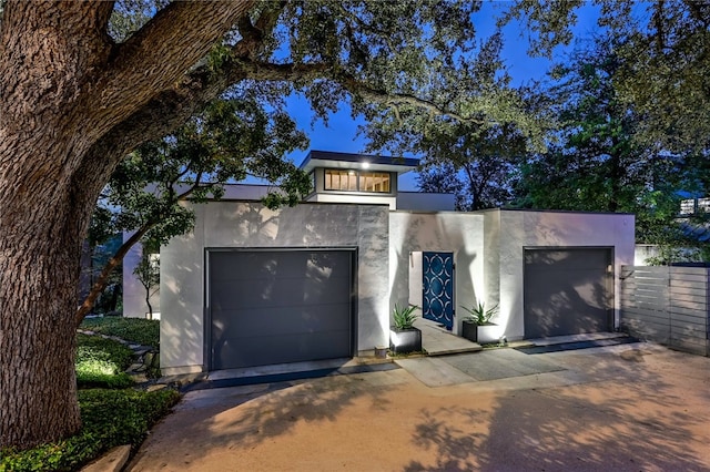 1337 Spyglass Dr, Austin, TX 78746 - modern home featuring concrete driveway and stucco siding