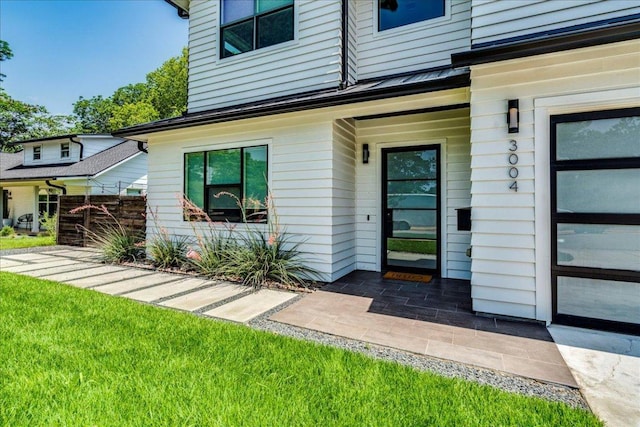 3004 Hunt Trl, Austin, TX 78757 - doorway to property with a yard and a standing seam roof