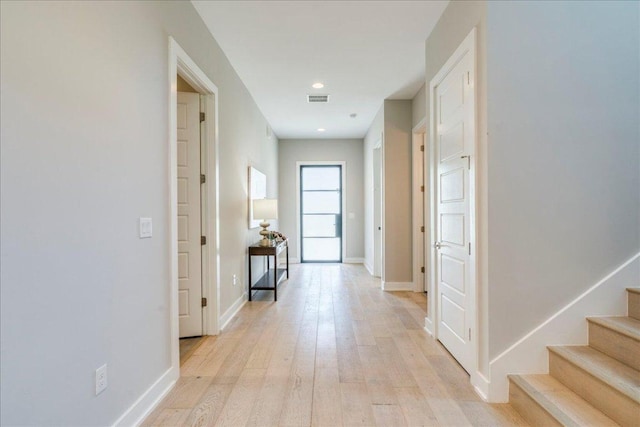 3004 Hunt Trl, Austin, TX 78757 - hall featuring light wood-type flooring, stairway, baseboards, and recessed lighting
