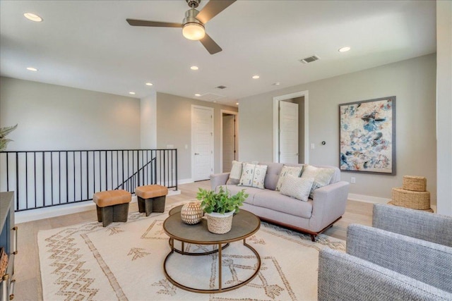 3004 Hunt Trl, Austin, TX 78757 - living room with ceiling fan, recessed lighting, light wood finished floors, and baseboards