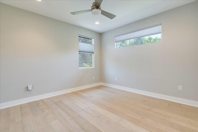 3004 Hunt Trl, Austin, TX 78757 - unfurnished room with light wood finished floors, recessed lighting, baseboards, and a ceiling fan