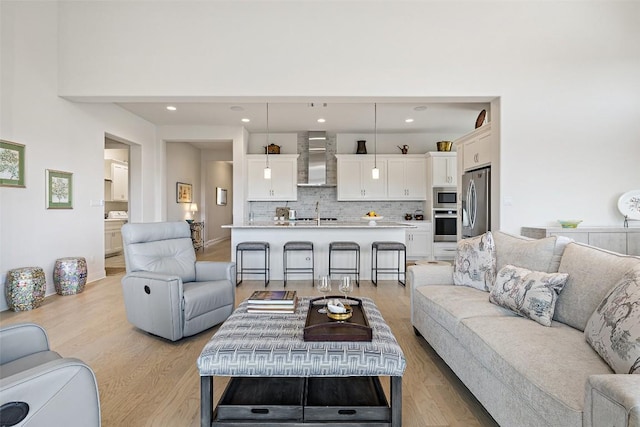 19401 Summit Glory Trl Unit 80, Spicewood, TX 78669 - living room with light wood-type flooring and recessed lighting