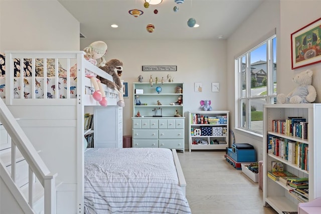 19401 Summit Glory Trl Unit 80, Spicewood, TX 78669 - bedroom with wood finished floors and recessed lighting