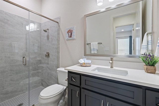 19401 Summit Glory Trl Unit 80, Spicewood, TX 78669 - full bathroom featuring vanity, a stall shower, toilet, and a textured wall