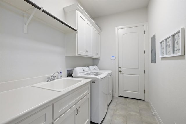 19401 Summit Glory Trl Unit 80, Spicewood, TX 78669 - washroom with independent washer and dryer, cabinet space, light tile patterned floors, baseboards, and electric panel