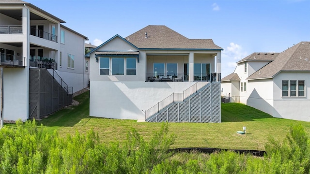 19401 Summit Glory Trl Unit 80, Spicewood, TX 78669 - back of house featuring stucco siding, a lawn, central AC unit, and stairs