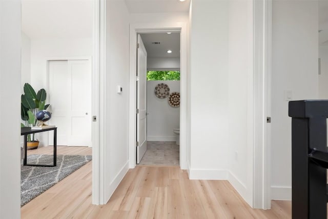 106 W Croslin St Unit B, Austin, TX 78752 - hall featuring light wood finished floors and baseboards