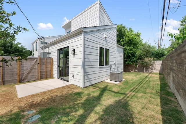 106 W Croslin St Unit B, Austin, TX 78752 - rear view of house featuring central AC unit and a gate