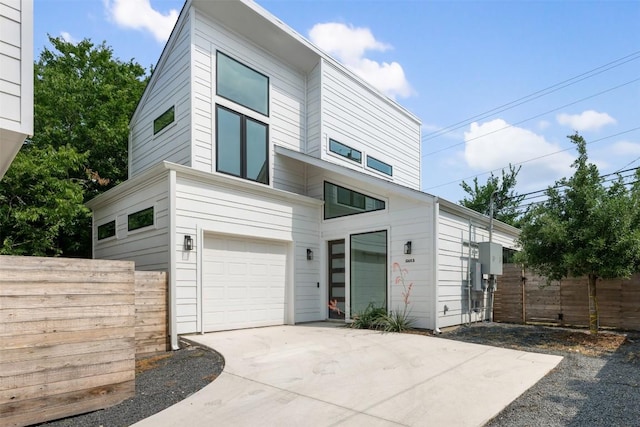 106 W Croslin St Unit B, Austin, TX 78752 - contemporary house featuring concrete driveway and an attached garage