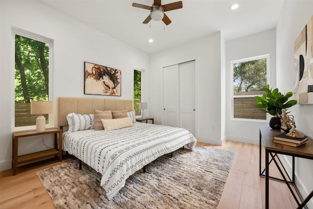 106 W Croslin St Unit B, Austin, TX 78752 - bedroom with light wood finished floors, recessed lighting, a closet, baseboards, and ceiling fan