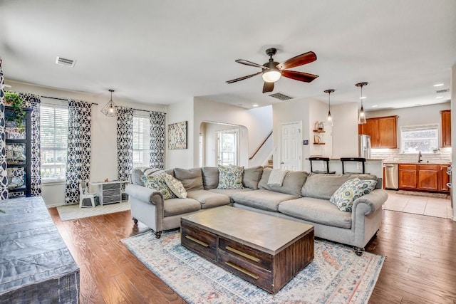 14028 Turkey Hollow Trl, Austin, TX 78717 - living room with plenty of natural light, a ceiling fan, stairway, light wood-style flooring, and recessed lighting