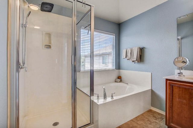 14028 Turkey Hollow Trl, Austin, TX 78717 - bathroom featuring a shower stall, vanity, a garden tub, and tile patterned floors