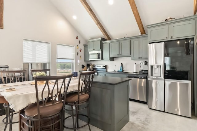 1581 Washburn Rd, Luling, TX 78648 - kitchen with stainless steel appliances, dark countertops, a sink, beam ceiling, and high vaulted ceiling