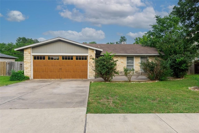 609 Pigeon Forge Rd, Pflugerville, TX 78660 - view of front of home featuring stone siding, an attached garage, and concrete driveway