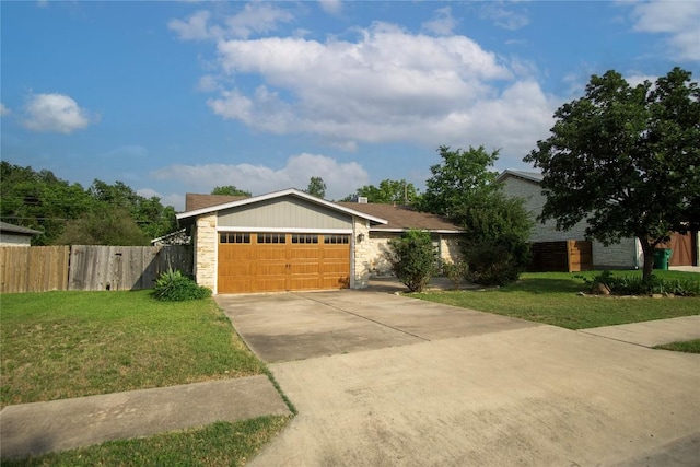 609 Pigeon Forge Rd, Pflugerville, TX 78660 - single story home with concrete driveway, an attached garage, and stone siding