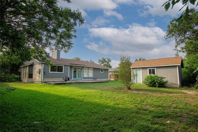 609 Pigeon Forge Rd, Pflugerville, TX 78660 - back of property with french doors, a yard, a chimney, and stone siding