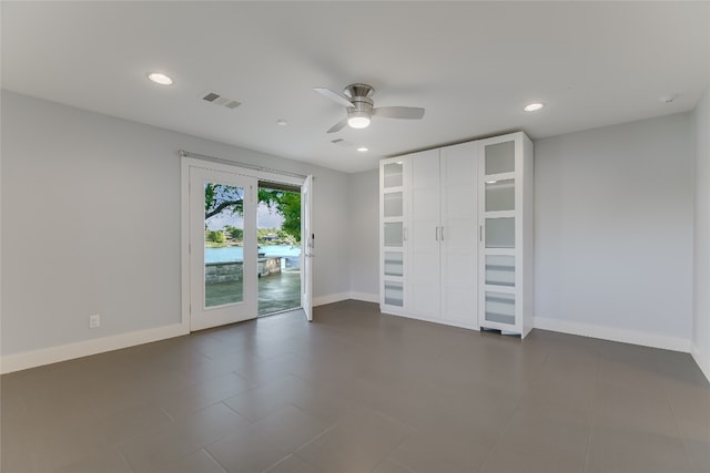 1704 Bluebonnet Ln, Kingsland, TX 78639 - unfurnished bedroom featuring access to outside, baseboards, recessed lighting, a ceiling fan, and dark tile patterned floors