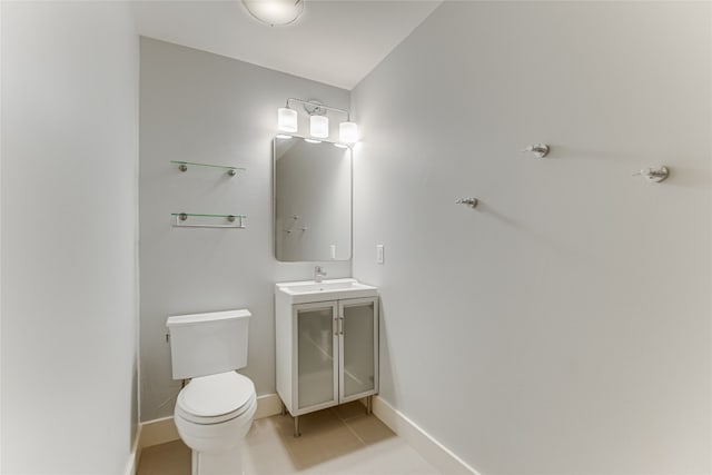 1704 Bluebonnet Ln, Kingsland, TX 78639 - half bath with toilet, tile patterned flooring, baseboards, and vanity