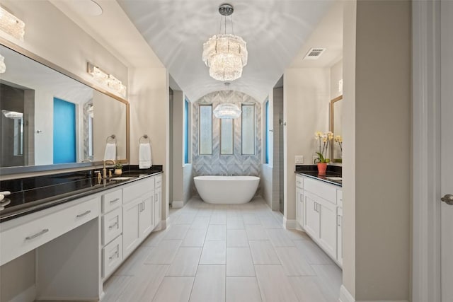 158 Baldovino Skwy, Lakeway, TX 78738 - full bath featuring a chandelier, vanity, a freestanding bath, and baseboards