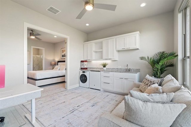 158 Baldovino Skwy, Lakeway, TX 78738 - laundry room with a ceiling fan, light wood-style floors, recessed lighting, baseboards, and washer and dryer