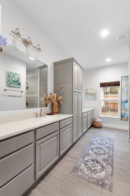 110 Lakecliff Cv, Kingsland, TX 78639 - bathroom with vanity, recessed lighting, and a shower