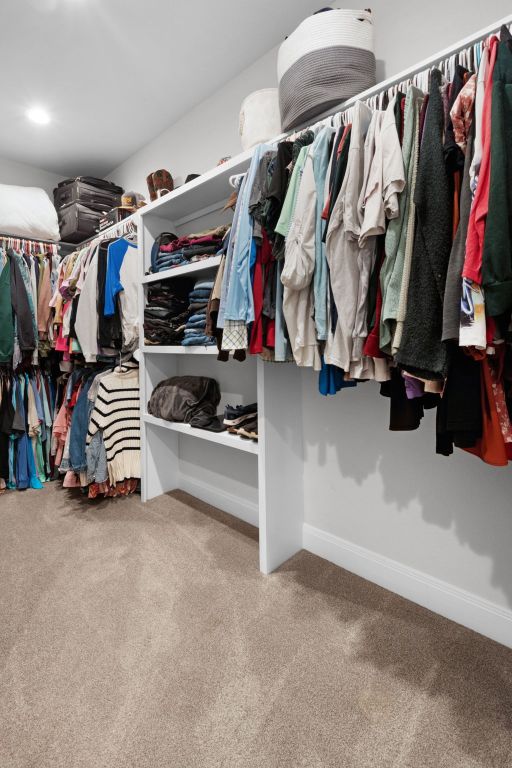 110 Lakecliff Cv, Kingsland, TX 78639 - walk in closet with carpet floors