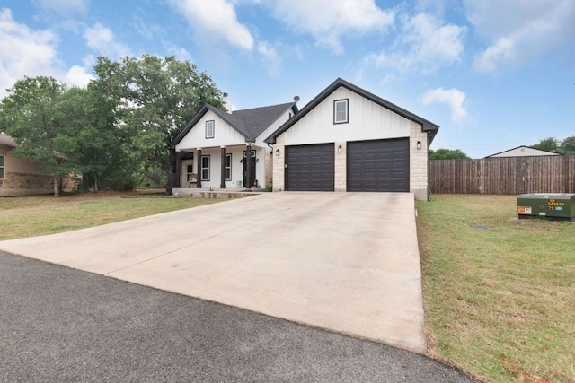 110 Lakecliff Cv, Kingsland, TX 78639 - modern farmhouse style home featuring concrete driveway, covered porch, a garage, board and batten siding, and brick siding