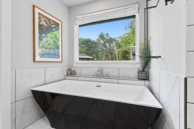 20702 Post Oak Dr, Lago Vista, TX 78645 - full bath featuring a soaking tub and tile walls