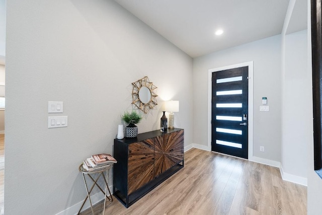 20702 Post Oak Dr, Lago Vista, TX 78645 - entrance foyer with light wood finished floors and baseboards