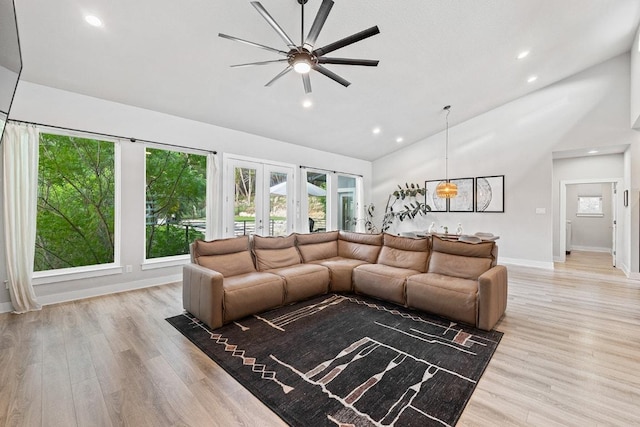 20702 Post Oak Dr, Lago Vista, TX 78645 - living area featuring a ceiling fan, light wood-style floors, high vaulted ceiling, and recessed lighting